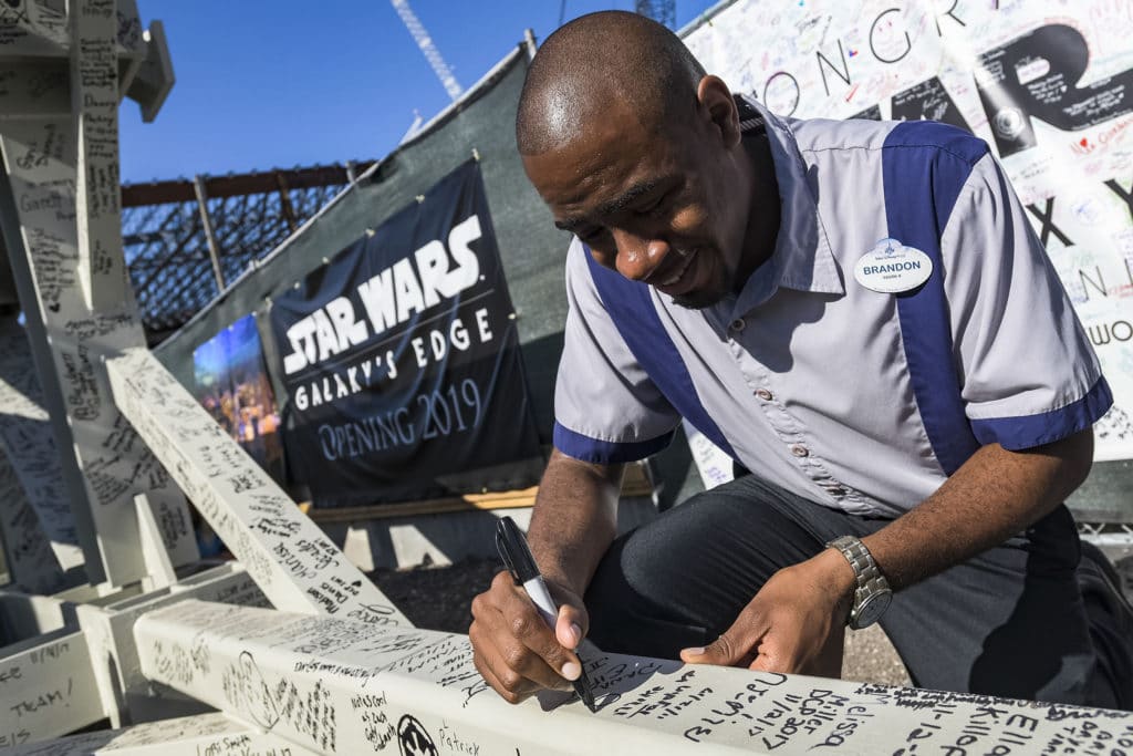 Disney's Hollywood Studios Cast Members Autograph Structural Beam for New Star Wars: Galaxy's Edge