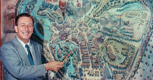 Walt Disney in front of a map of Disneyland, Anaheim